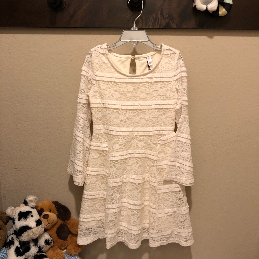 Lace dress with draping belled sleeves